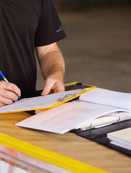 An engineer writing notes