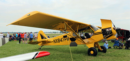 A Piper Cub similar to the one flown by the author.